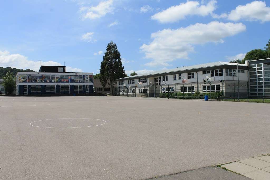 A photo of a section of the academy building, taken from the playground area.