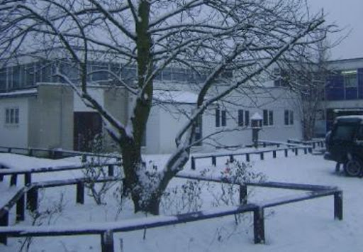Photo of the Hayesbrook Academy building surrounded by Snow during the Wintertime.