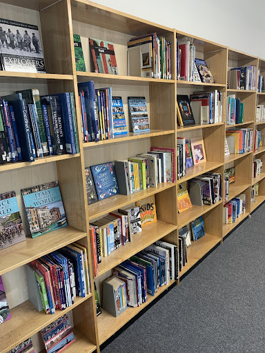 A photo of a bookcase full of books in the Library.